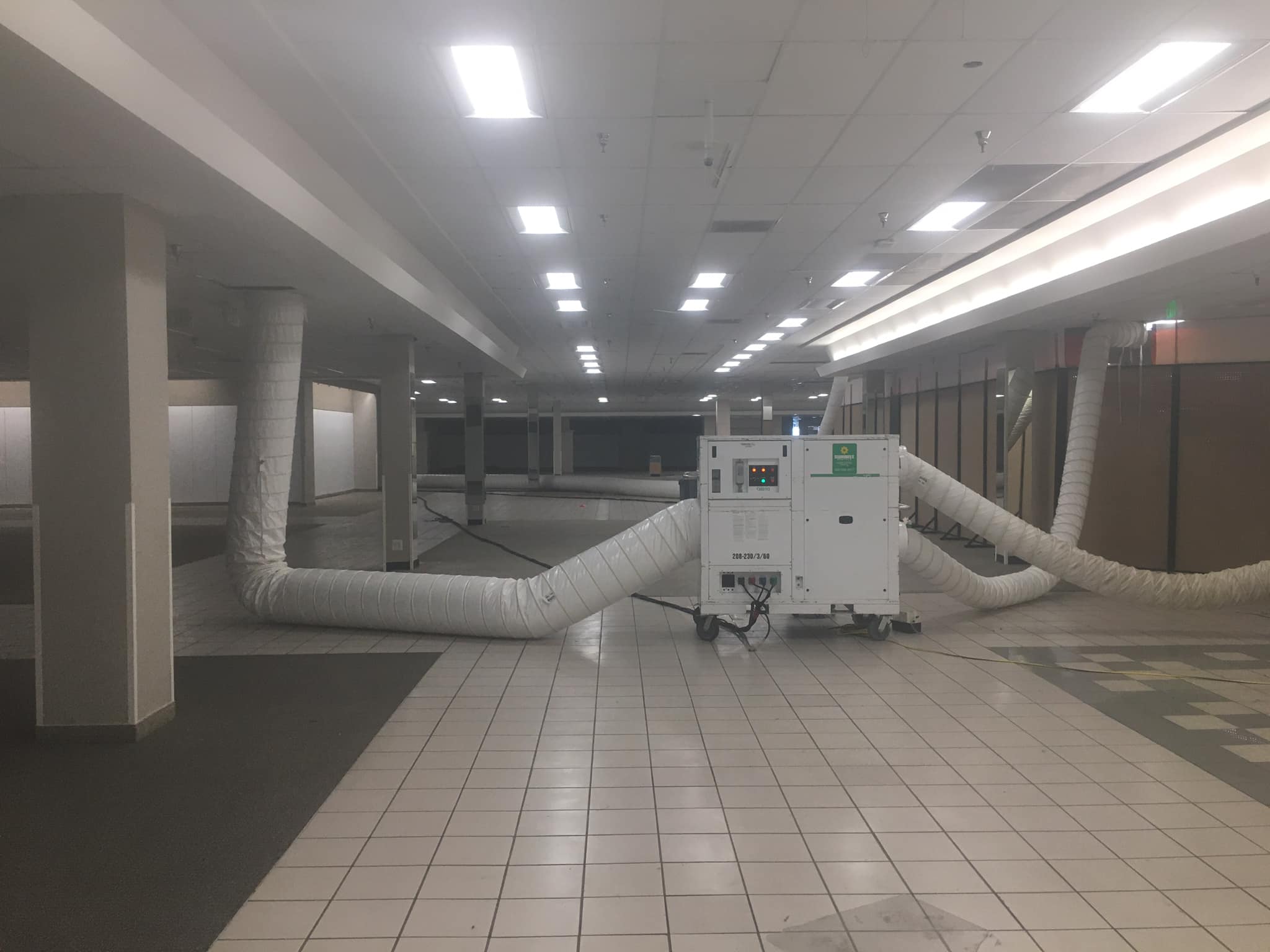 Okay, let's break down this image through the lenses you've provided. Given the image’s particular subject matter (remediation equipment in a seemingly abandoned or minimally occupied public space), certain analyses w...