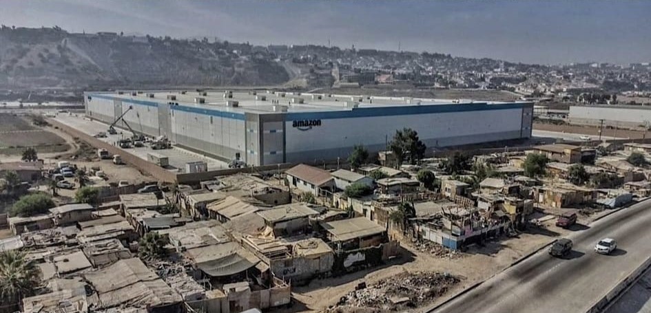 Okay, let's break down the image using the requested theoretical frameworks. It’s a strong image ripe for analysis, revealing significant power dynamics and socio-economic contradictions. **Visual Description** The ph...