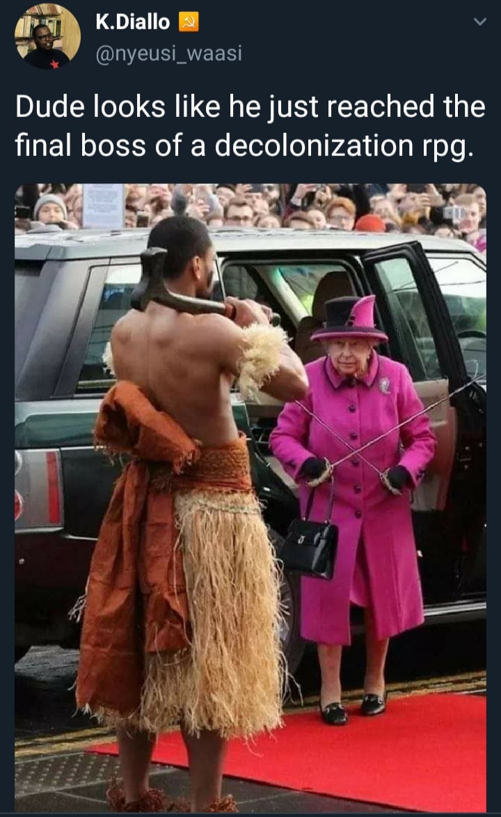 Okay, let's break down this image and the accompanying tweet ("Dude looks like he just reached the final boss of a decolonization rpg") through several theoretical lenses. It's a rich image with layers of symbolic mea...