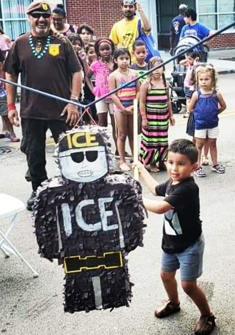 Okay, let's break down this image using the requested theoretical frameworks. It's a complex image, so some sections will be more substantial than others. **Visual Description** The photograph depicts a group of child...