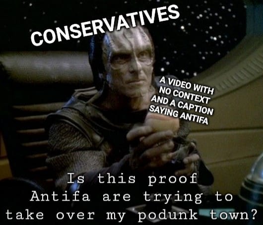 Okay, let's break down this meme using the theoretical frameworks requested. It's a layered image with a lot to unpack! ## Visual Description The image is a screenshot from the science fiction television show *Star Tr...