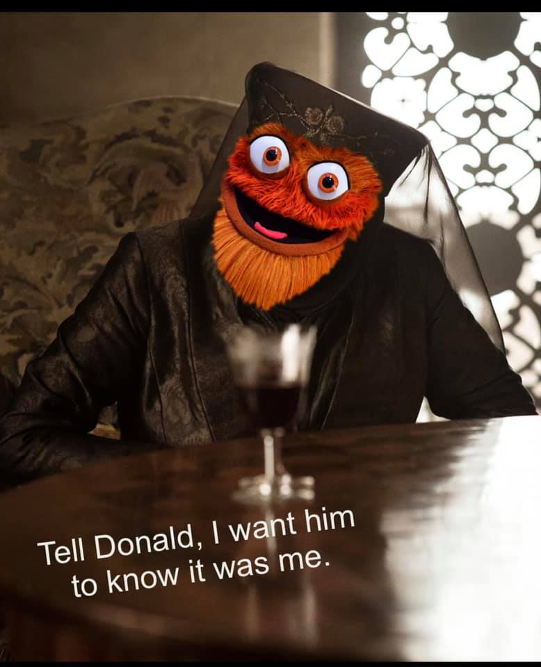 Okay, let's break down this image, which is... quite a lot. It's a digitally manipulated image of the Philadelphia Flyers mascot, Gritty, appearing in a highly unusual and potentially unsettling context. Here's an ana...
