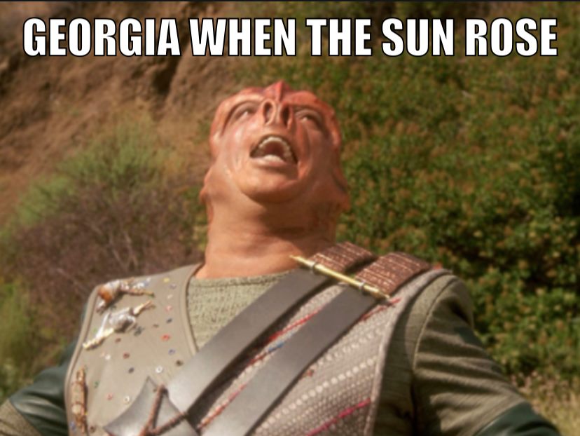 Okay, let's break down the meme featuring a still from the film *Monty Python's Life of Brian* and the text “Georgia When the Sun Rose” using the theoretical frameworks you’ve requested. It’s a bit of a ride, as the i...