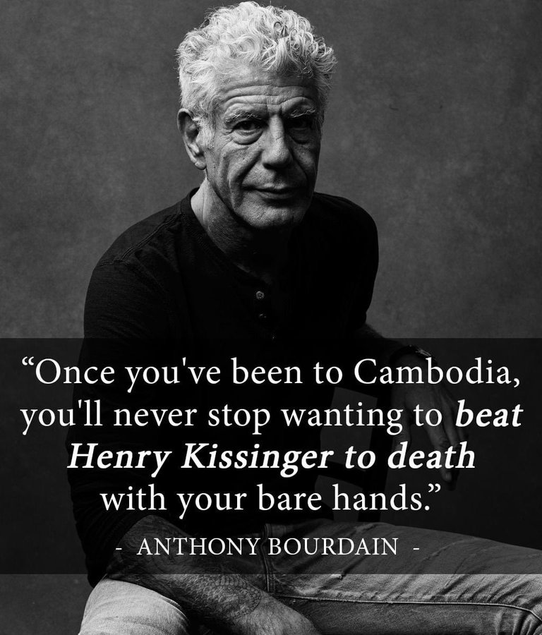 Here's an analysis of the image and quote, broken down into relevant sections as requested. **Visual Description** The image is a stark black and white portrait of Anthony Bourdain. He appears to be in his late years,...
