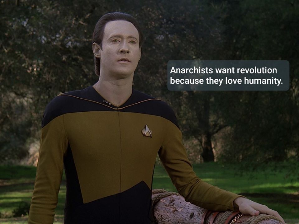 Okay, here's an analysis of the image, broken down into relevant theoretical frameworks. Given the content (a Star Trek character with an anarchist statement), certain frameworks will be more applicable than others. *...