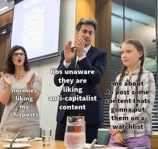 Okay, let's break down this meme with the requested theoretical lenses. **Visual Description** The image is a stock photo featuring three people. A man in a suit stands at the center, clapping enthusiastically. A woma...