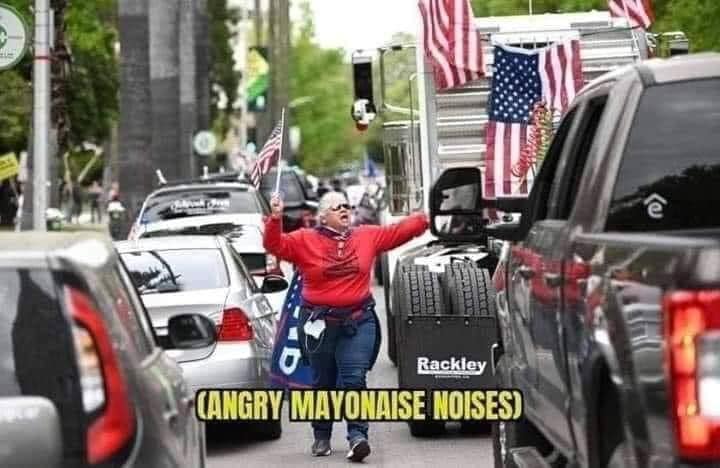 Okay, let's break down this image through the lenses you requested. It's a complex image and several lenses will be more applicable than others. **Visual Description** The image depicts a middle-aged man standing in t...