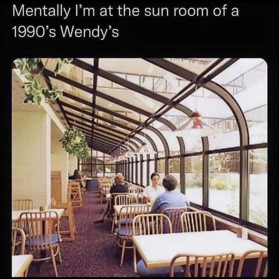 Okay, here's an analysis of the image of the 1990s Wendy's sunroom, broken down into sections based on the requested theoretical lenses. I'll indicate where a lens *doesn't* particularly apply. **Visual Description**...