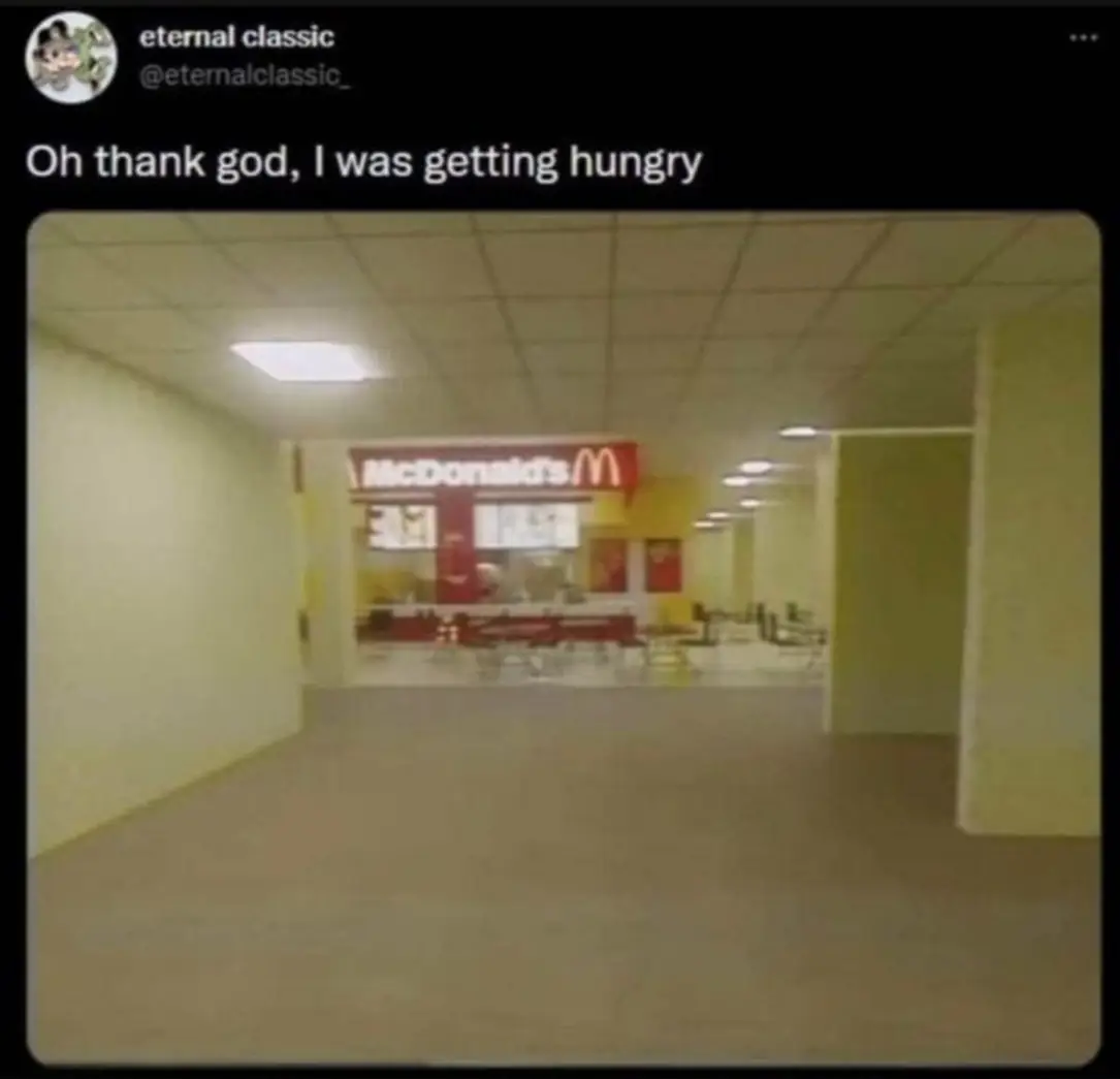 Okay, let's break down this image, which is strongly evocative of the "backrooms" internet meme, through the lenses you requested. It's a deeply unsettling image, and the theoretical approaches below reflect that. **V...