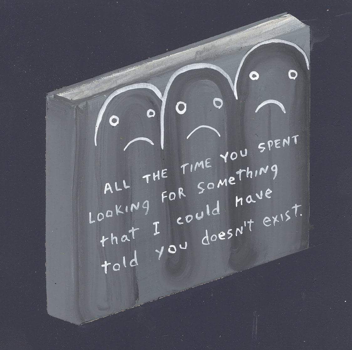 Okay, let's break down this image through various critical lenses. **Visual Description** The image depicts a small, three-dimensional canvas or box-like structure, seemingly painted with a dark grey or black paint. A...