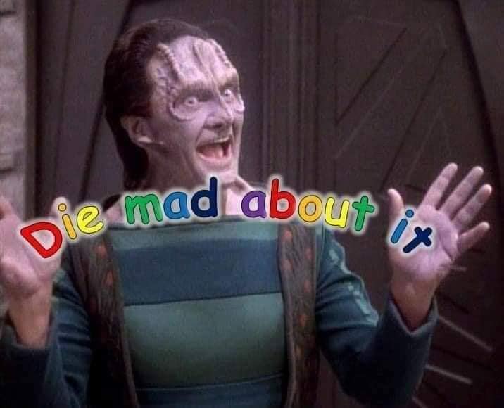 Okay, let's analyze the image of the character from *Star Trek: The Next Generation* (Quark, a Ferengi) with the added text "Die mad about it," through various critical lenses, only where applicable. **1. Visual Descr...
