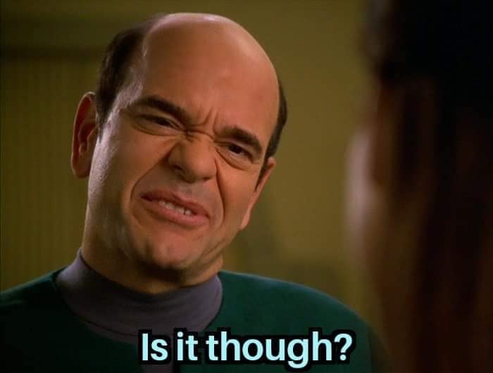 Okay, let's break down this image of Alfred Molina with the caption "Is it though?" through various theoretical lenses. **1. Visual Description** The image is a close-up shot of actor Alfred Molina, looking somewhat a...