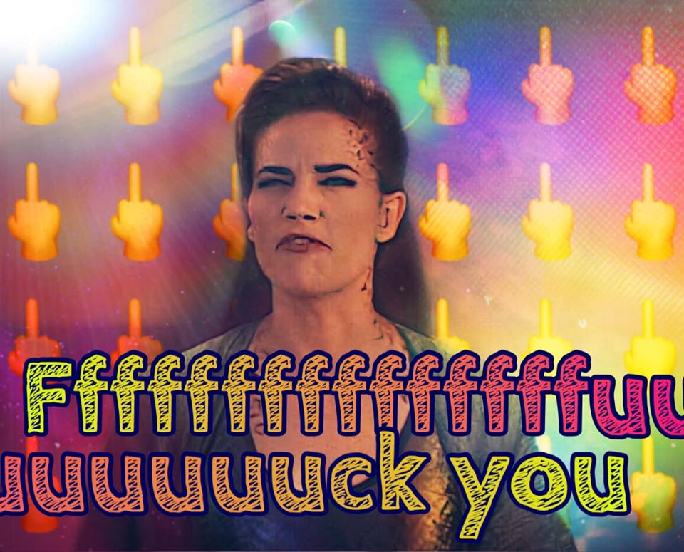 Okay, let's break down this image through a few different theoretical lenses. ## Visual Description The image features a portrait of a woman with a stern, defiant expression. She has dark hair and light skin, and her...