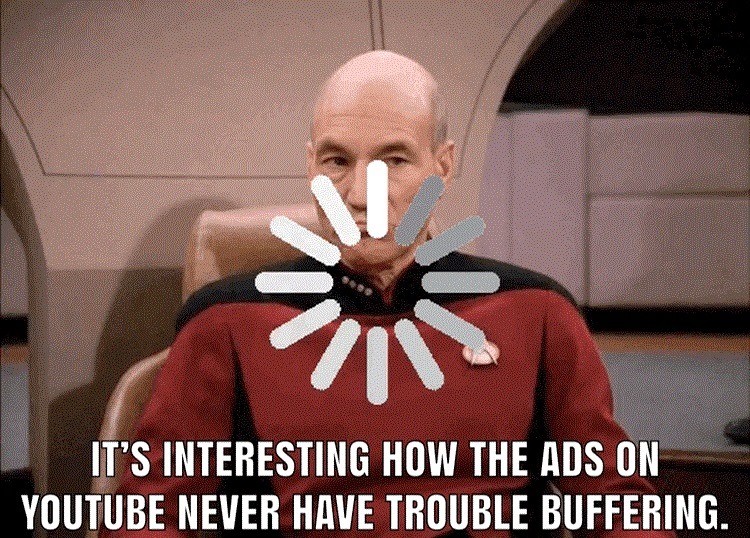 Okay, let's break down this meme through several theoretical lenses. **Visual Description** The image is a screenshot from *Star Trek: The Next Generation*, featuring Captain Jean-Luc Picard sitting in his command cha...