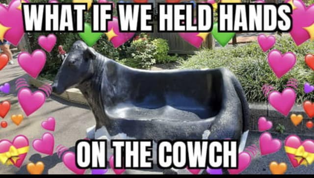 Okay, let's break down this image and its potential readings through various theoretical lenses. **Visual Description** The image depicts a dark, abstract sculpture resembling a cow or some sort of large animal. It ha...