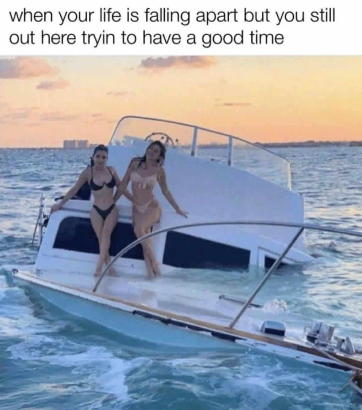 Okay, let's break down this meme image through the requested theoretical lenses. It's a rich image for analysis! **Visual Description** The image depicts two young women standing on the severely tilted deck of a parti...