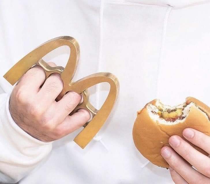 Here's an analysis of the image, broken down into sections as requested. I'll indicate if a heading isn't particularly applicable. **Visual Description** The image features a person's hands holding two distinct elemen...