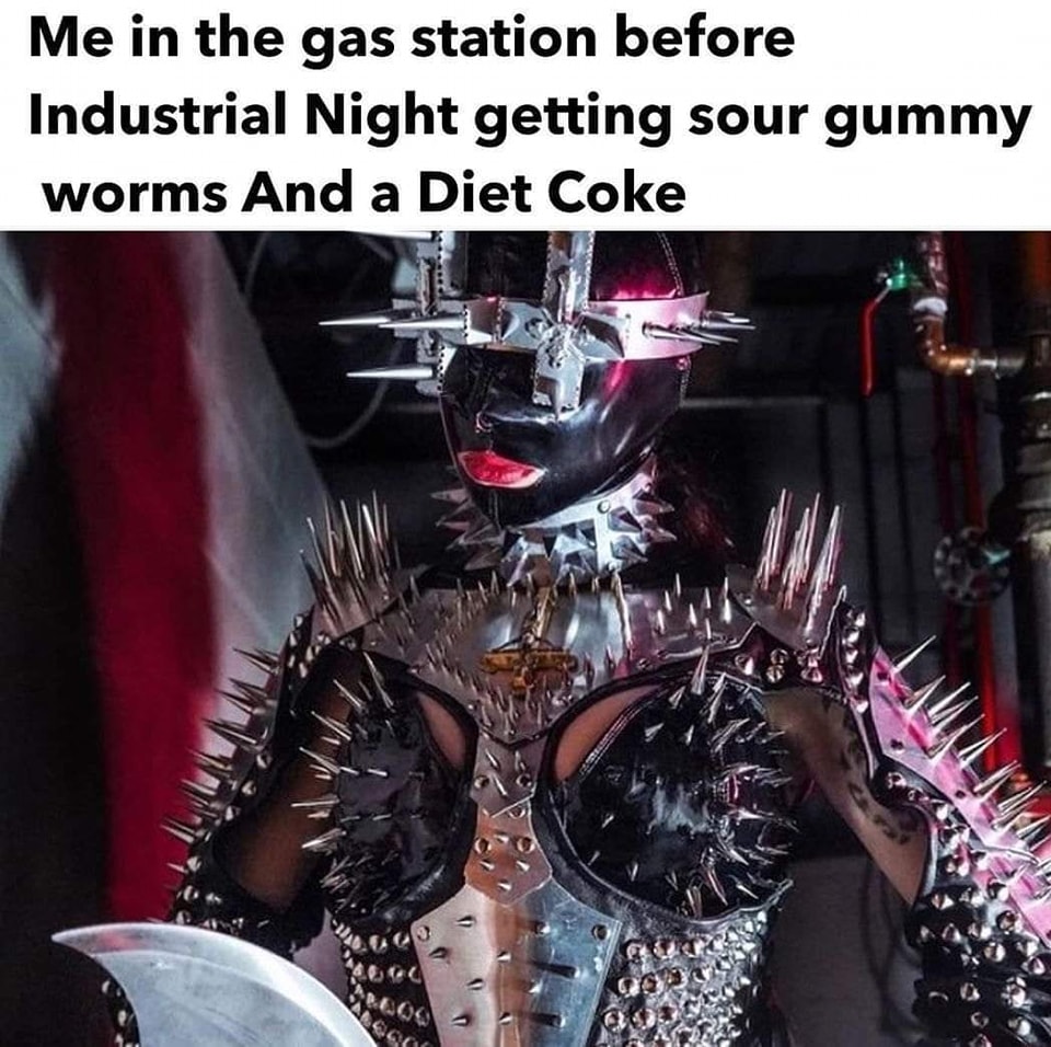 Okay, let's break down this image with the requested theoretical lenses. It's a rich one, and we'll see where the analysis takes us. **Visual Description** The image depicts a person in highly stylized, dramatic attir...