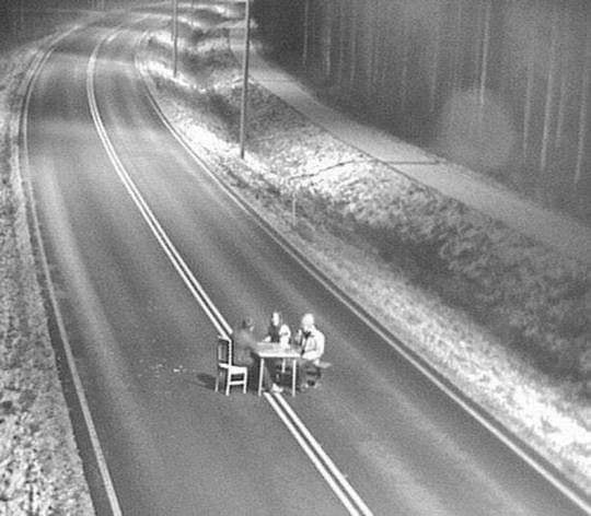 Okay, let's break down this striking image with the requested theoretical frameworks. It's a compelling image that lends itself to a variety of interpretations. ## Visual Description The photograph presents a bird’s-e...