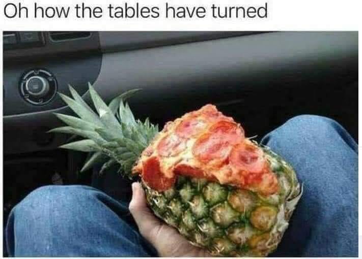 Okay, let's break down this curious image of a half-devoured pineapple in a car, applying different theoretical lenses. ## Visual Description The image depicts a person’s hands holding a pineapple that has been visibl...