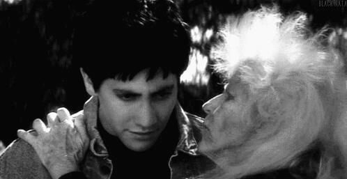 Okay, let's break down this striking image with the requested theoretical lenses. Please note that the interpretation depends on context (which is missing from just the image), so I'll work with what's visible and ass...