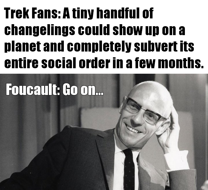 Okay, let's break down this meme through the lenses you've provided. **Visual Description** The image is a black and white photograph of Michel Foucault, the prominent French philosopher. He's seated, leaning back sli...