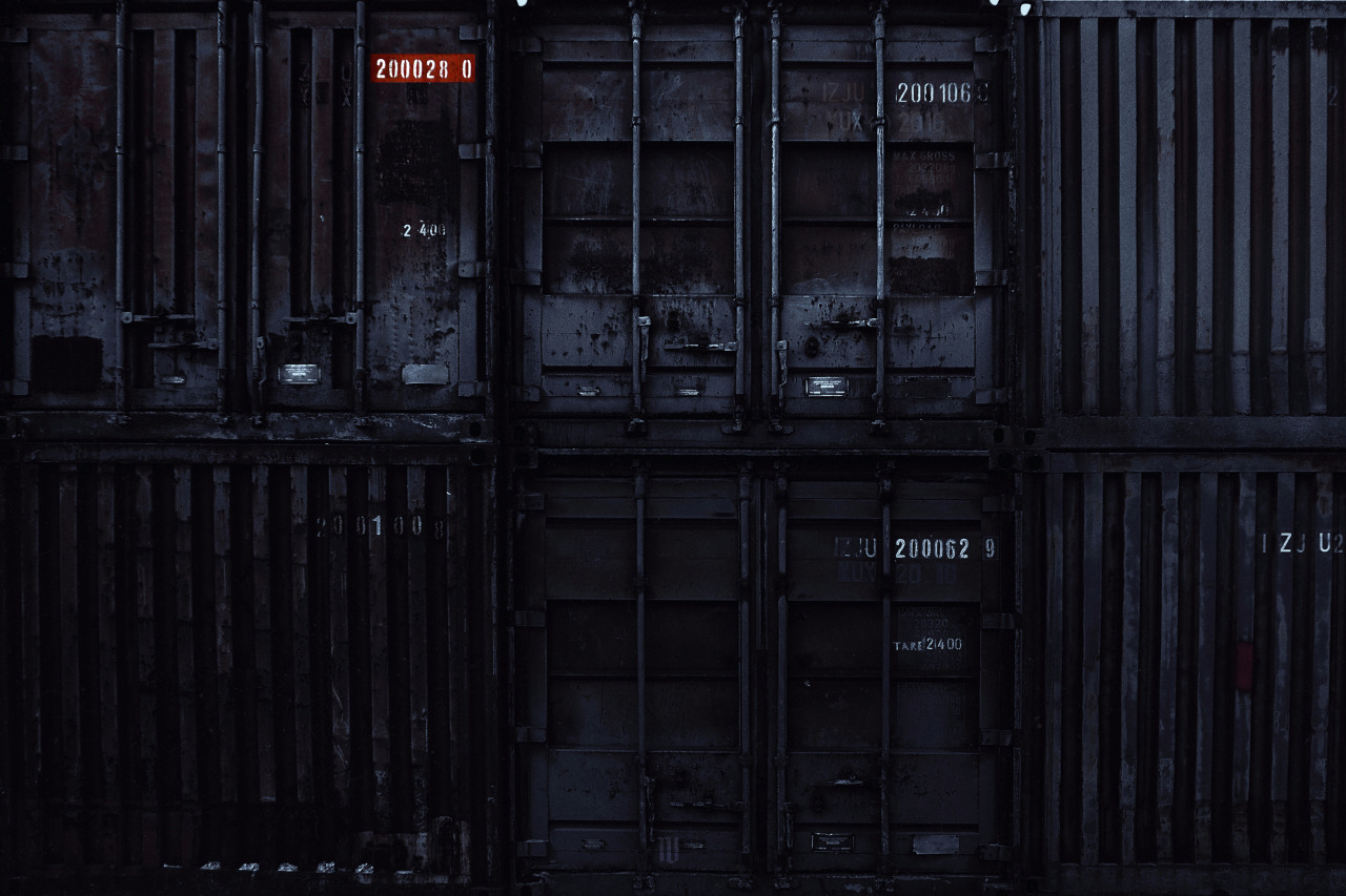 Okay, let's break down this image through the lenses you've requested. Given the subject matter (shipping containers), some of these lenses will be more relevant and developed than others. ## Visual Description The im...