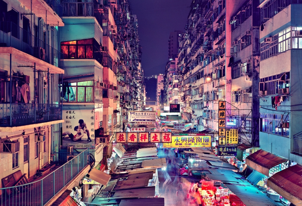 Okay, let's break down this photograph with a lens toward the requested theoretical frameworks. It’s a compelling image, rich with potential for analysis. **Visual Description** The photograph captures a densely packe...