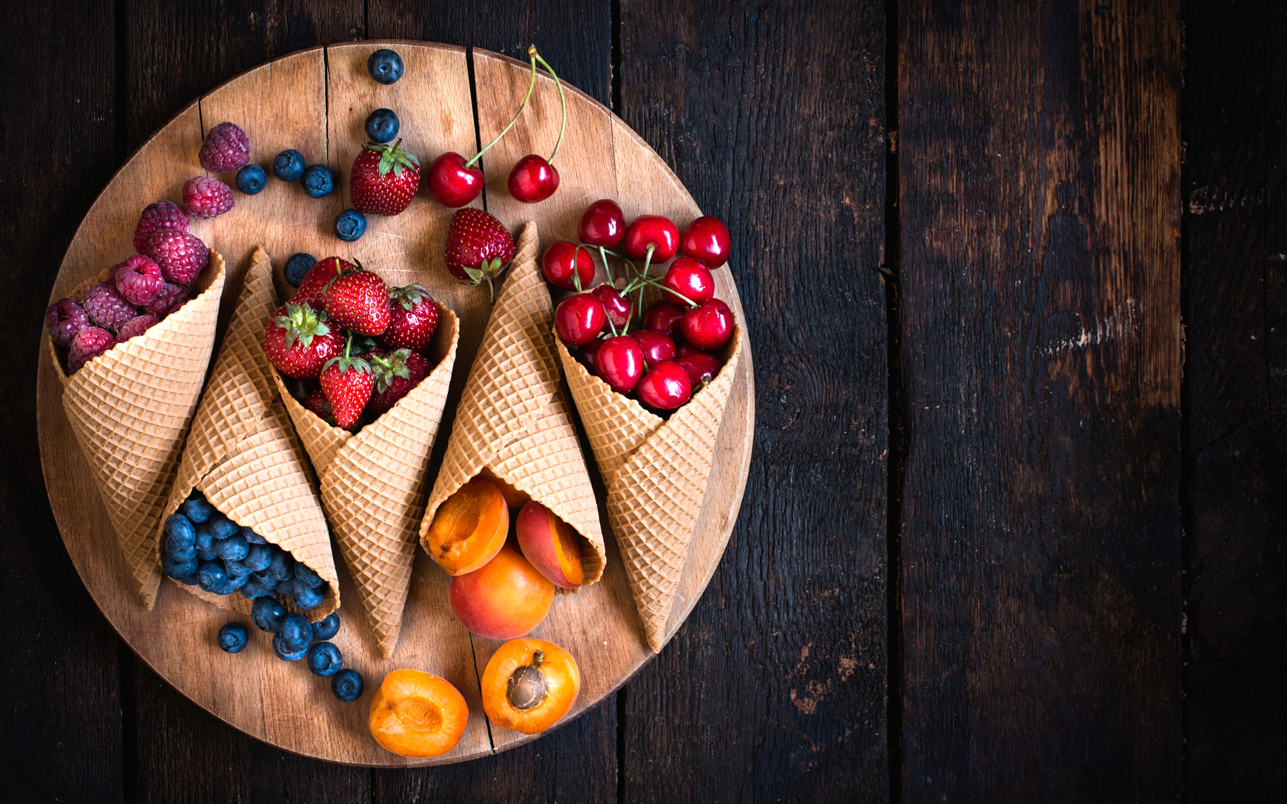 Okay, let's break down the image through several theoretical lenses. ## Visual Description The image is a top-down, flat-lay photograph depicting a wooden serving board covered with an arrangement of fresh berries and...