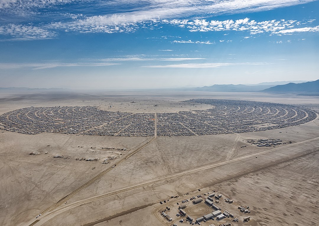 Okay, here's an analysis of the image, broken down into the requested theoretical frameworks. It's important to note that applying these frameworks is interpretive; there isn't a single "correct" reading. I'll also in...