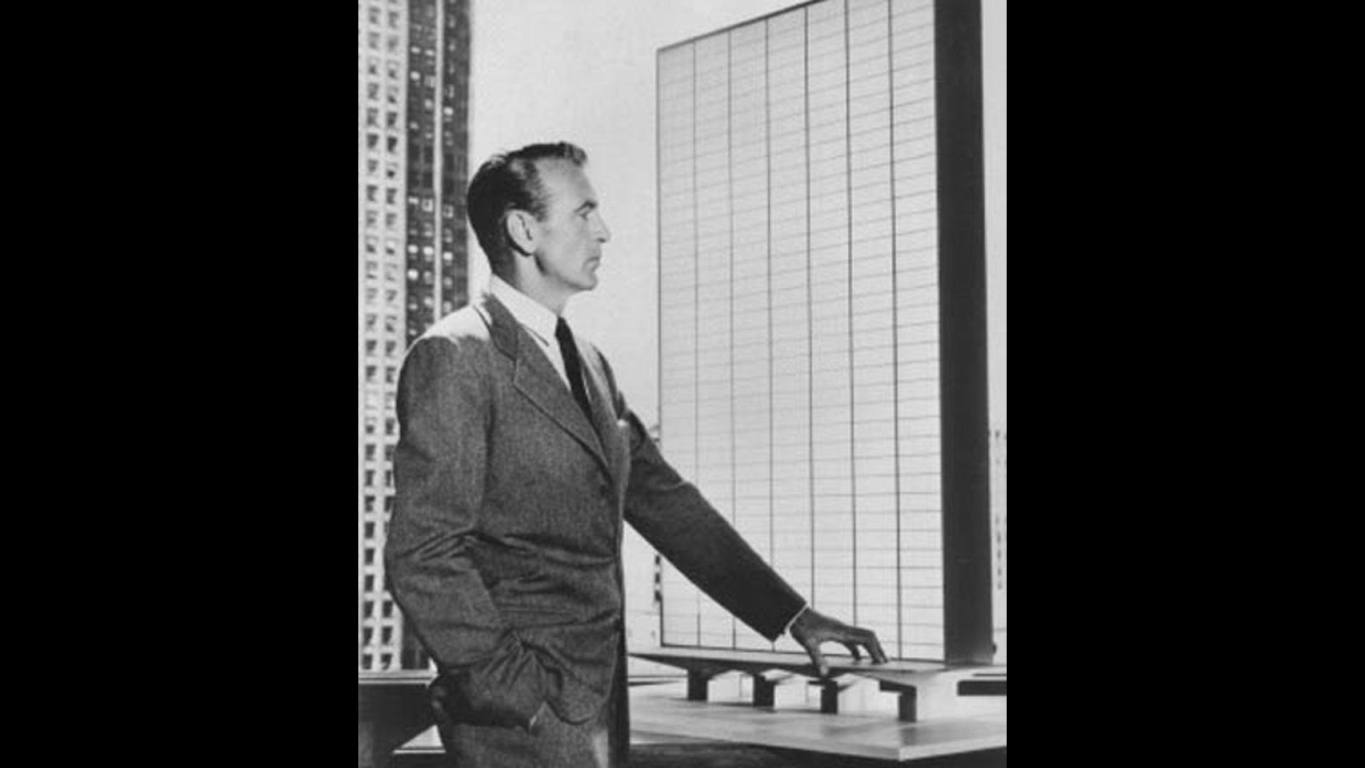 Here's an analysis of the image, broken down into sections as requested. I will note where sections are not applicable based on the image's content. **Visual Description** The image is a black and white photograph fea...