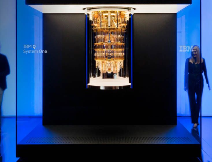 Okay, let's break down the image of the IBM Quantum System One using the requested theoretical frameworks. **Visual Description** The image depicts a striking installation of the IBM Quantum System One, a quantum comp...