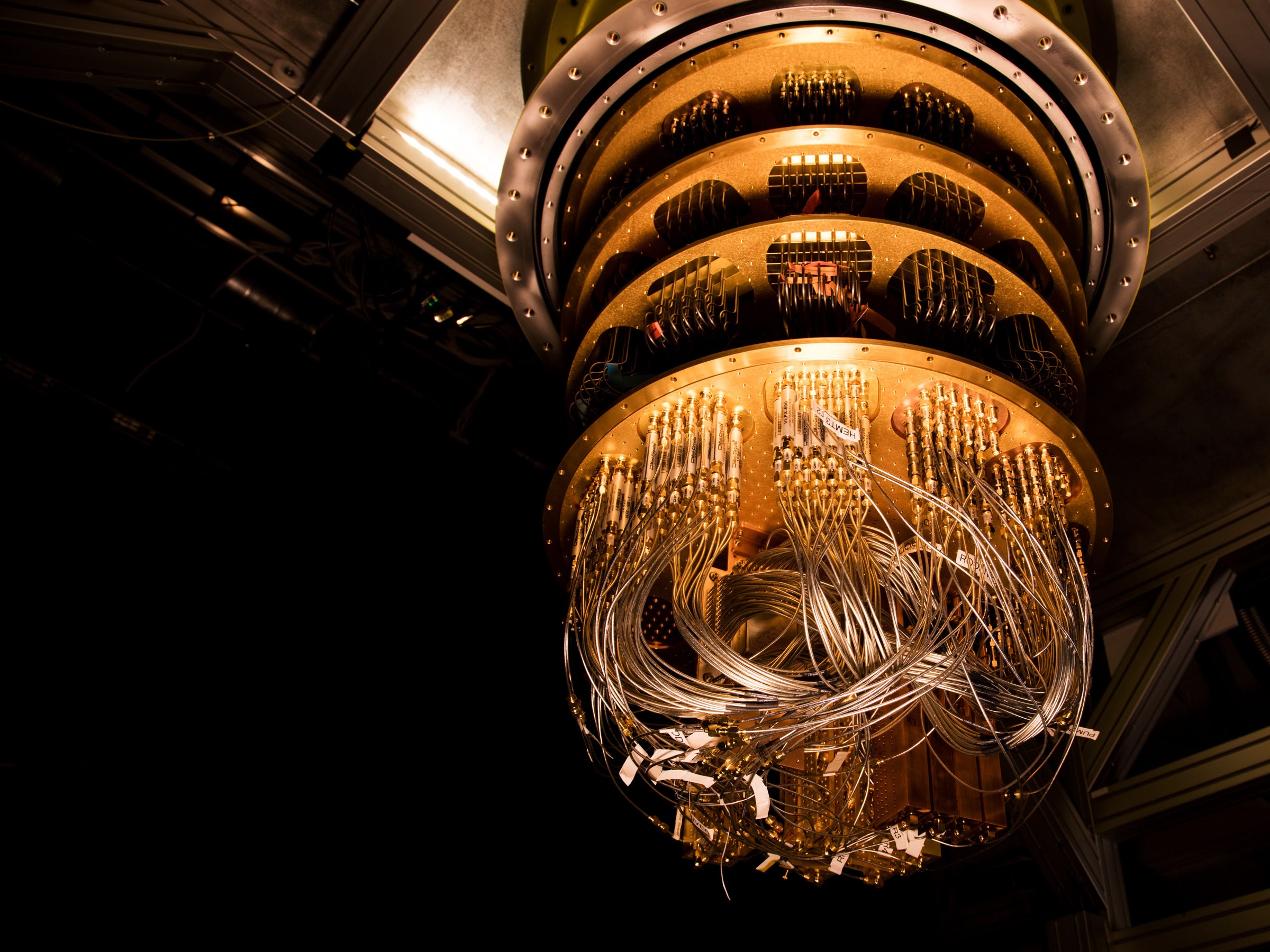 Okay, let's break down the image with the requested analytical lenses. **Visual Description** The image presents a striking and complex view of what appears to be the interior of advanced technological equipment, like...