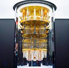 Okay, let's analyze the image of the quantum computer within the specified theoretical frameworks. **Visual Description** The image depicts a large, cylindrical structure, likely housed within a clear protective casin...