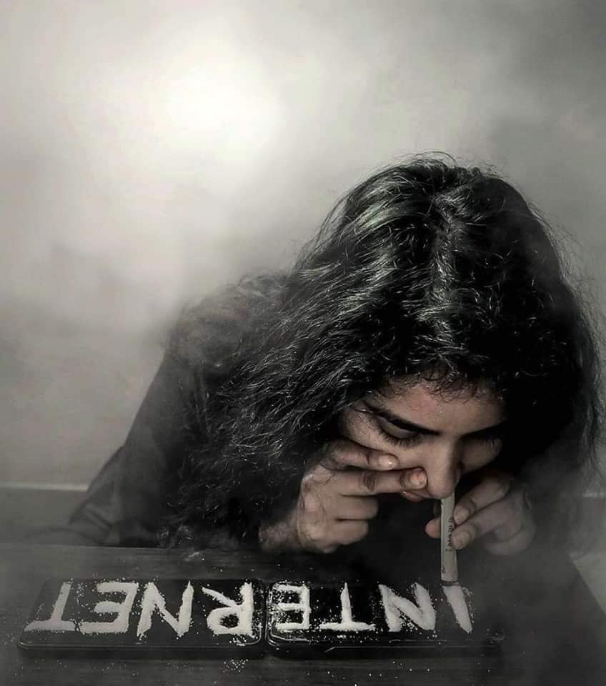 Okay, let's analyze the image provided through the requested theoretical lenses. **Visual Description** The image is a dramatically lit, high-contrast photograph of a person, seen from a slightly elevated angle, deepl...