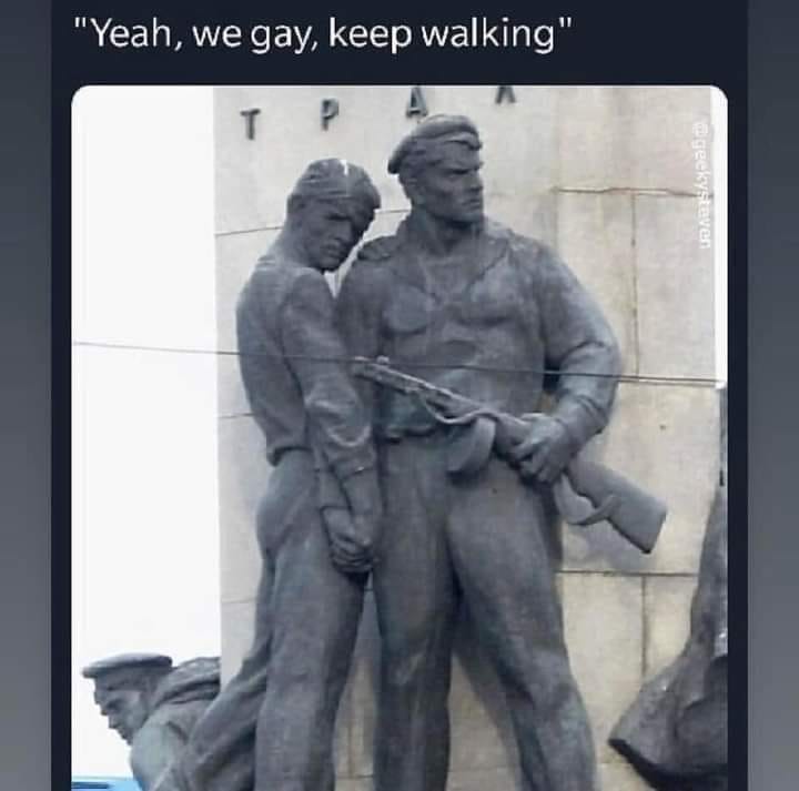 Okay, let's break down this image and its accompanying caption ("Yeah, we gay, keep walking") through the lenses of various theoretical frameworks. **Visual Description** The image is a photograph of a monumental Sovi...