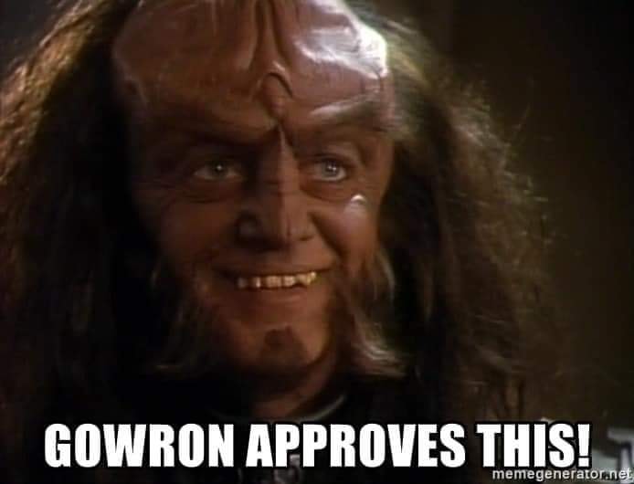 Okay, let's break down this image/meme through the lenses you've requested. It's important to note this is interpretive, and multiple readings are possible. The image is of the character Gowron from *Star Trek: Deep S...