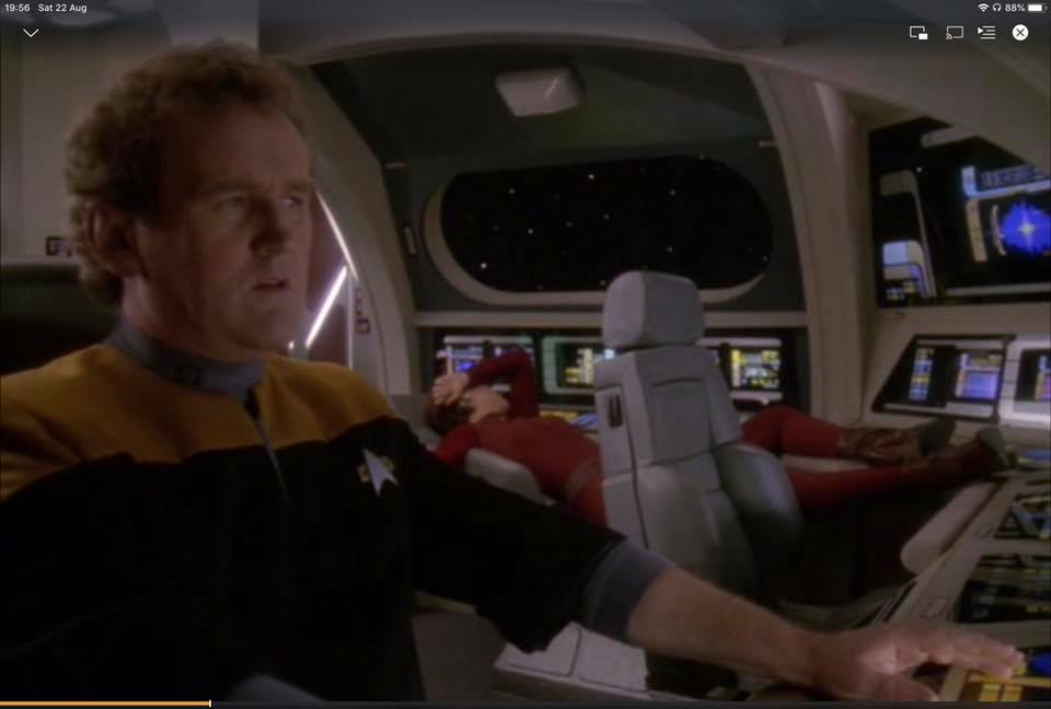 Okay, let's analyze the image provided, drawing upon the requested theoretical frameworks where applicable. **Visual Description** The image is a screen capture from likely a Star Trek series, specifically featuring W...