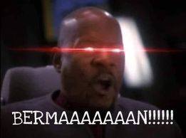 Okay, let's break down this meme image using the requested theoretical lenses. It's a potent visual with a lot to unpack! **1. Visual Description** The image depicts a close-up of Samuel L. Jackson as Jules Winnfield...