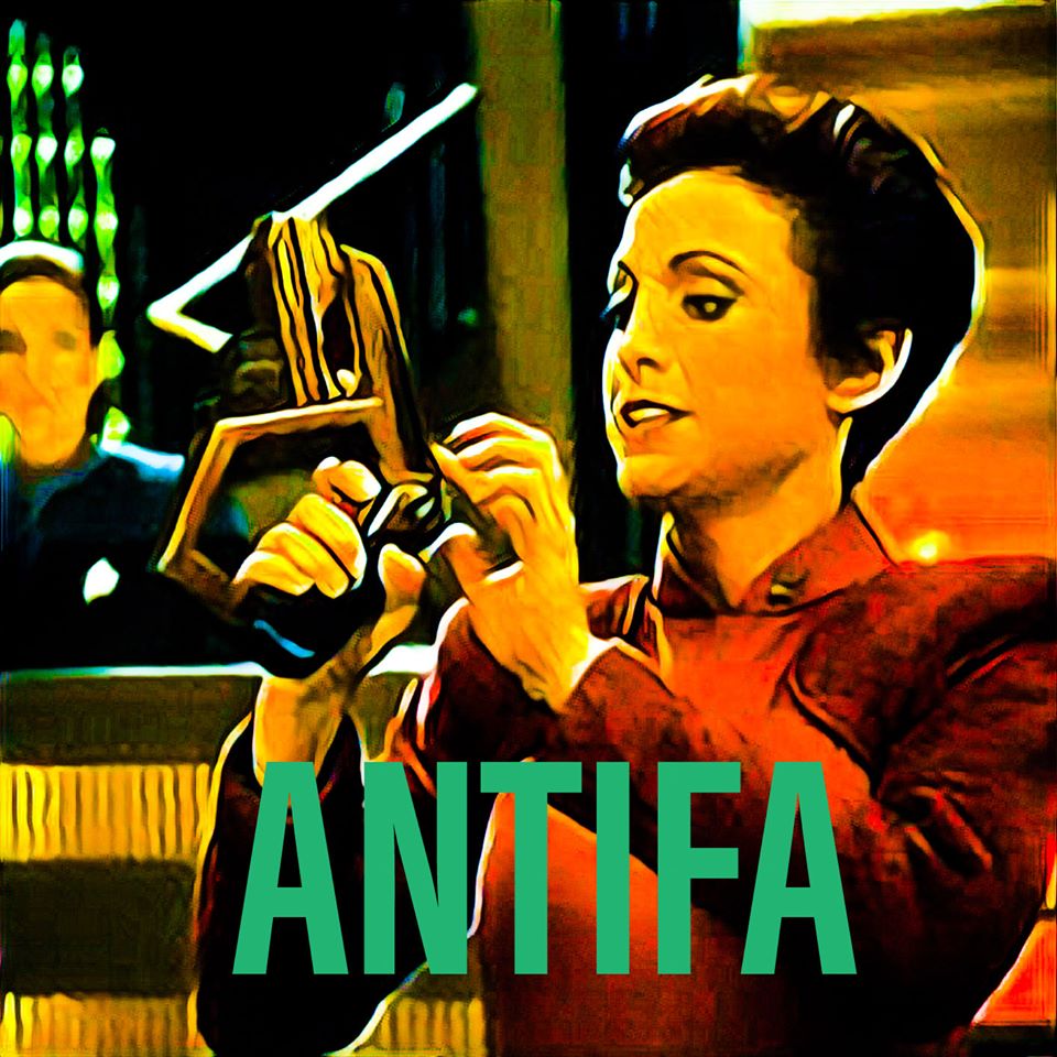 Here's an analysis of the image, broken down into sections based on the theoretical frameworks you requested. Given the image and the overlaid text "ANTIFA," the analysis will lean heavily into those themes. It’s impo...