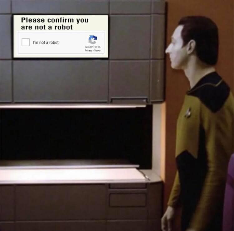 Okay, let's break down this image through several critical lenses. It's a surprisingly rich image considering its simple composition. ## Visual Description The image features a scene from *Star Trek: The Next Generati...