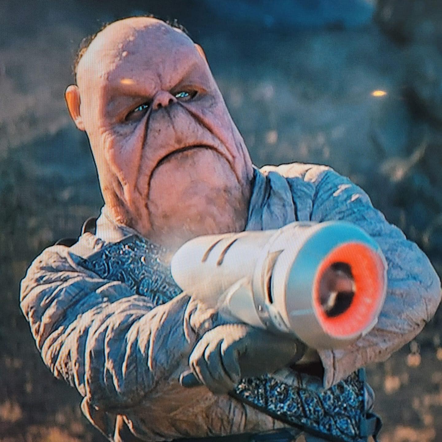 Okay, let's break down this image, which appears to be a still from a science fiction context, likely *Dune* (based on the character's design and costuming). We'll do so through the lenses you've requested, applying t...