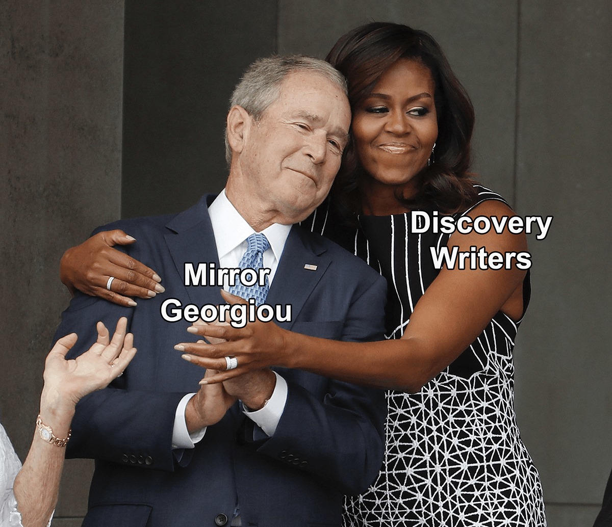 Okay, let's break down this image through the lenses of the requested theoretical frameworks. **Visual Description** The image captures a moment of apparent warmth and connection between two individuals: George W. Bus...