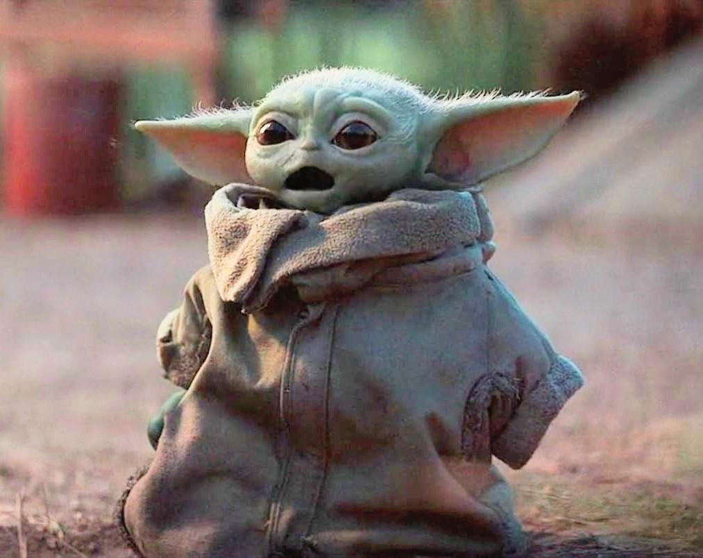 Okay, let's break down this image of Grogu (aka "Baby Yoda") through various critical theory lenses. Please note, these are interpretations based on the image and the broader context of *The Mandalorian*—and can be su...