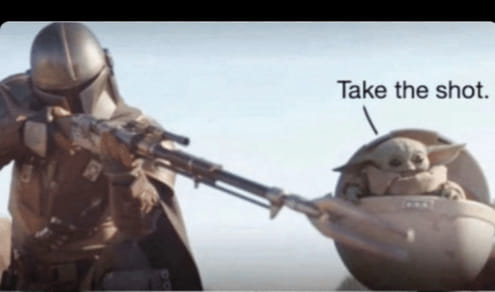 Okay, let's break down this image of the Mandalorian and Grogu ("Baby Yoda") with a few theoretical lenses. It's a *very* meme-able image, so it lends itself to a lot of interpretive approaches. **Visual Description**...