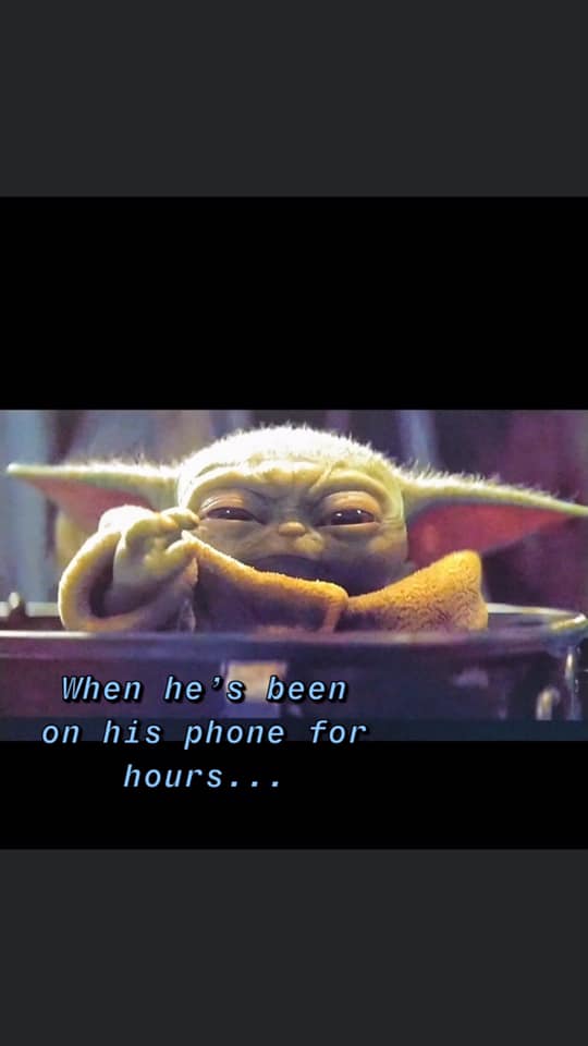Okay, let's analyze this image of "Baby Yoda" (Grogu) with the caption "When he's been on his phone for hours..." through the requested theoretical lenses. **1. Visual Description** The image features Grogu, a charact...