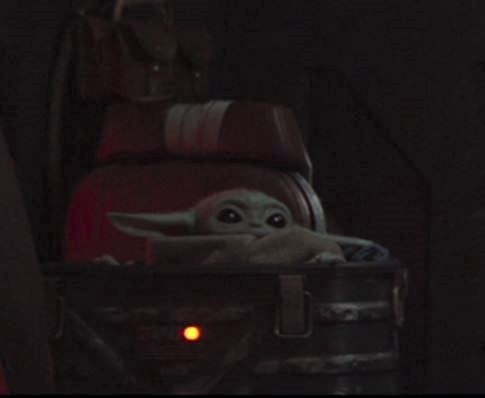 Okay, let's break down this image of Grogu (Baby Yoda) from *The Mandalorian* through various critical theory lenses. Given the shadowy, somewhat limited visual information, the analyses will be focused on how the ima...