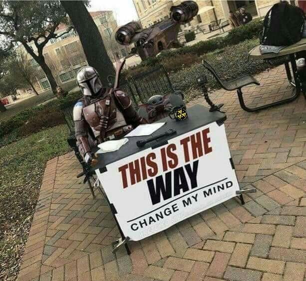 Okay, let's break down this image using the requested theoretical frameworks. I'll include sections only where the framework applies meaningfully. ## Visual Description The image depicts a person dressed as "The Manda...