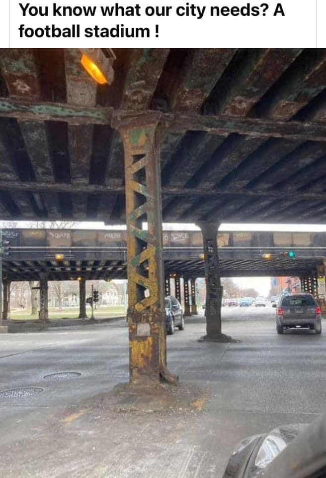 Okay, let's break down this image and the accompanying text ("You know what our city needs? A football stadium!") through several theoretical lenses. ## Visual Description The image depicts a heavily urban scene, spec...